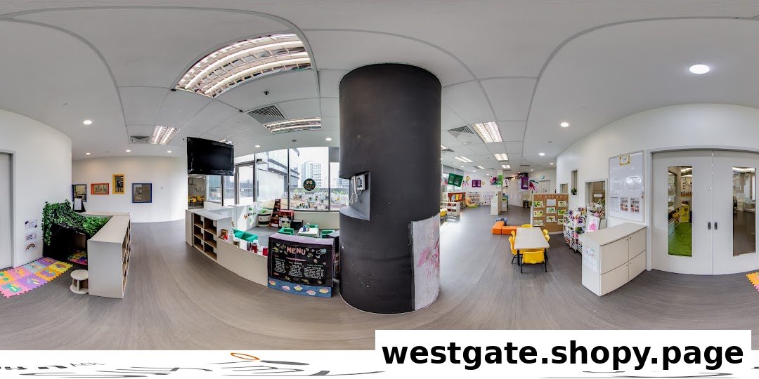 A bright, spacious interior of a childcare center with child-friendly furniture and learning areas.