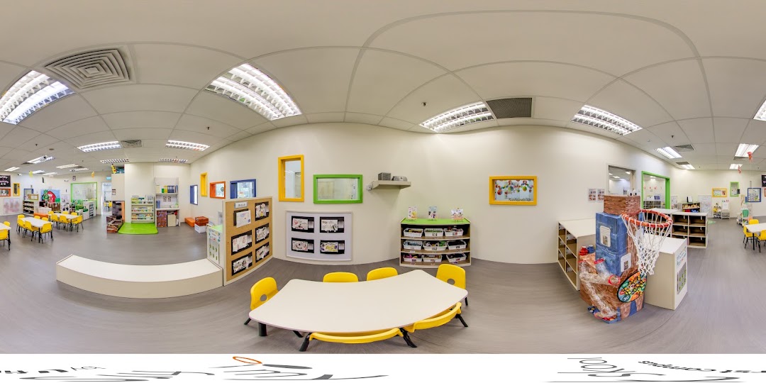 A bright and spacious classroom interior at My First Skool, featuring colorful furniture and learning areas.