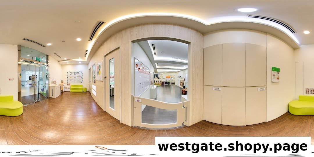 A bright, spacious interior of a childcare center with child-friendly seating and learning areas.