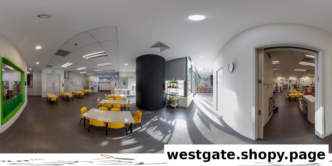 A bright, spacious interior of a childcare center featuring colorful tables and chairs for children.
