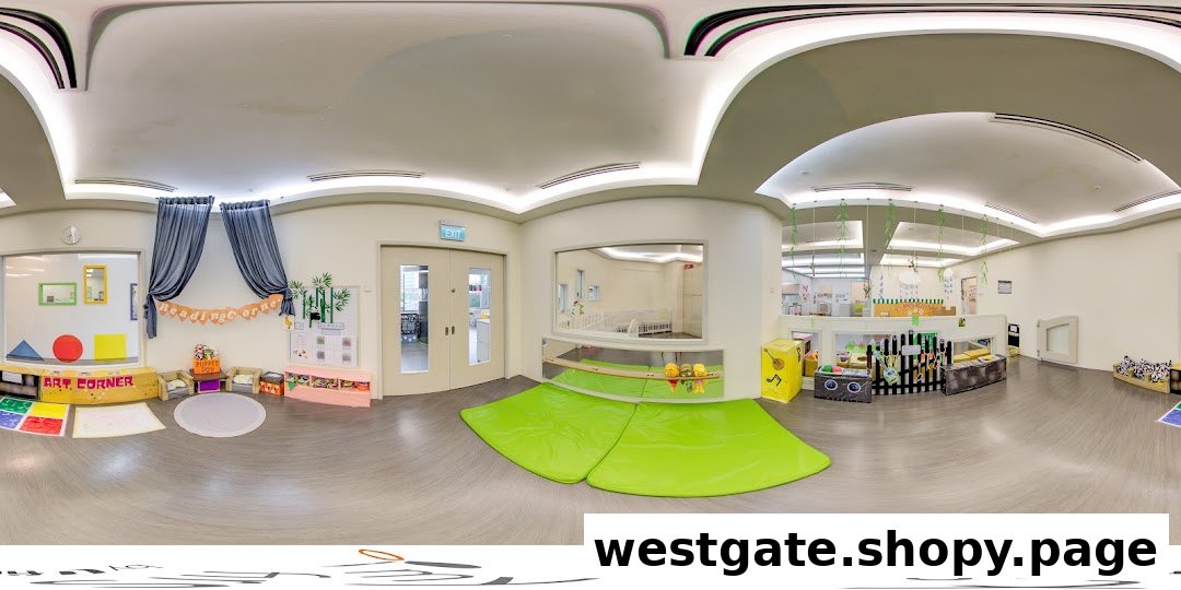 A bright, spacious, and well-equipped interior of a childcare center with various learning and play zones.