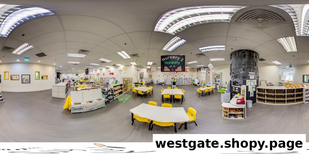 A bright, spacious classroom at My First Skool, featuring colorful tables, chairs, and learning activity areas.