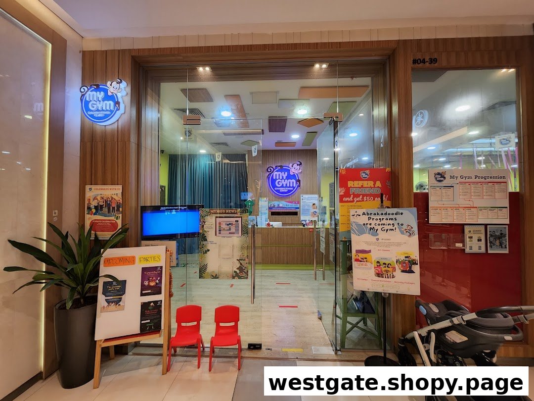 The brightly lit entrance of My Gym Jurong East, a children's fitness center, with promotional displays.