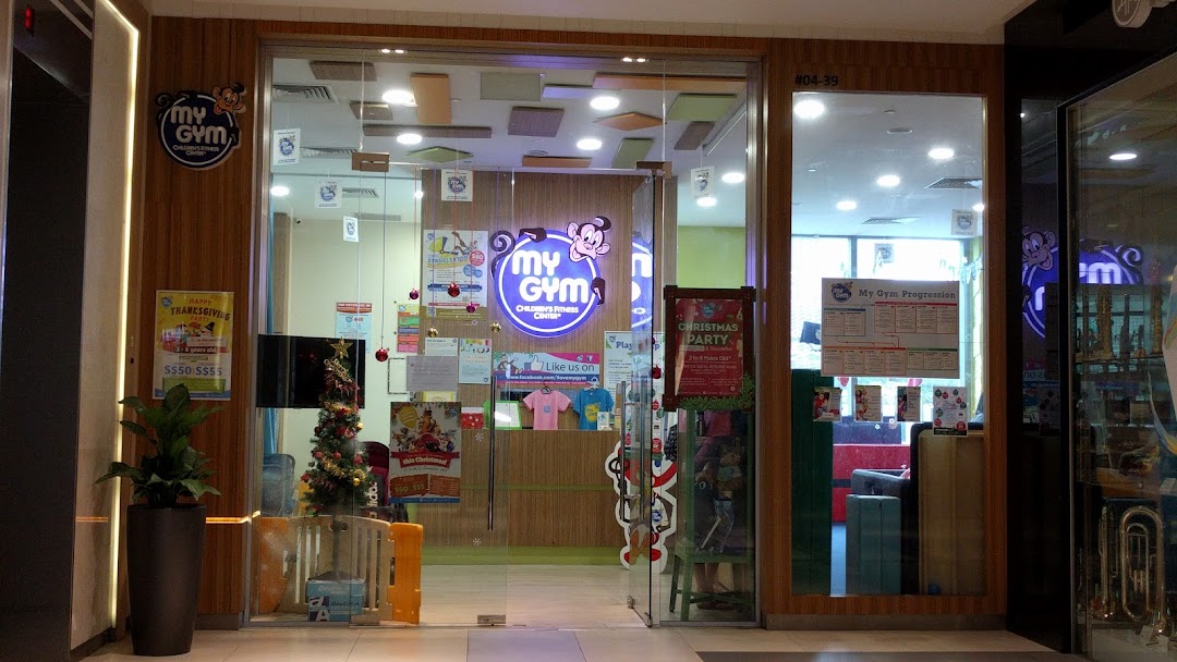 The brightly lit entrance of My Gym Children's Fitness Center, adorned with festive decorations.