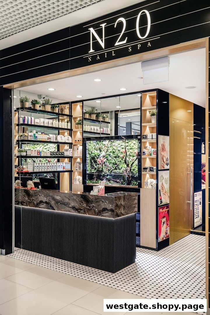 The inviting entrance of N20 Nail Spa, featuring a modern reception desk, product displays, and lush green decor.