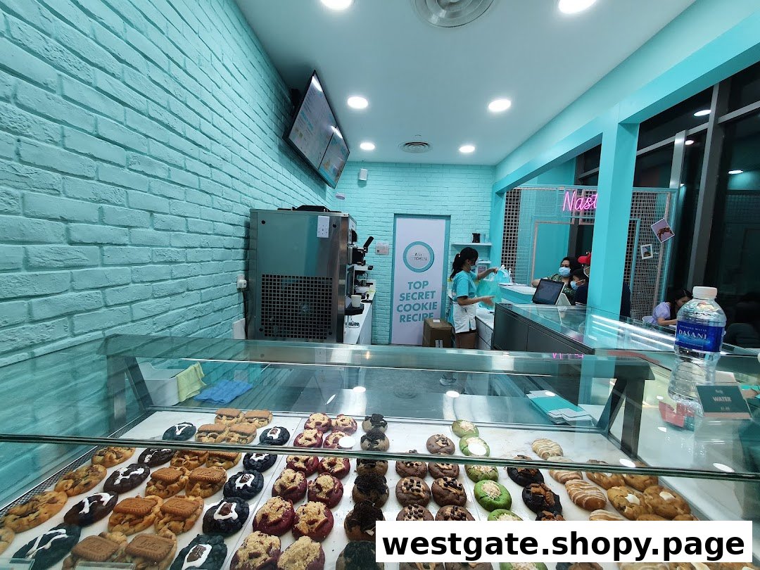 A vibrant interior shot of Nasty Cookie, showcasing a wide array of gourmet cookies in a display case.