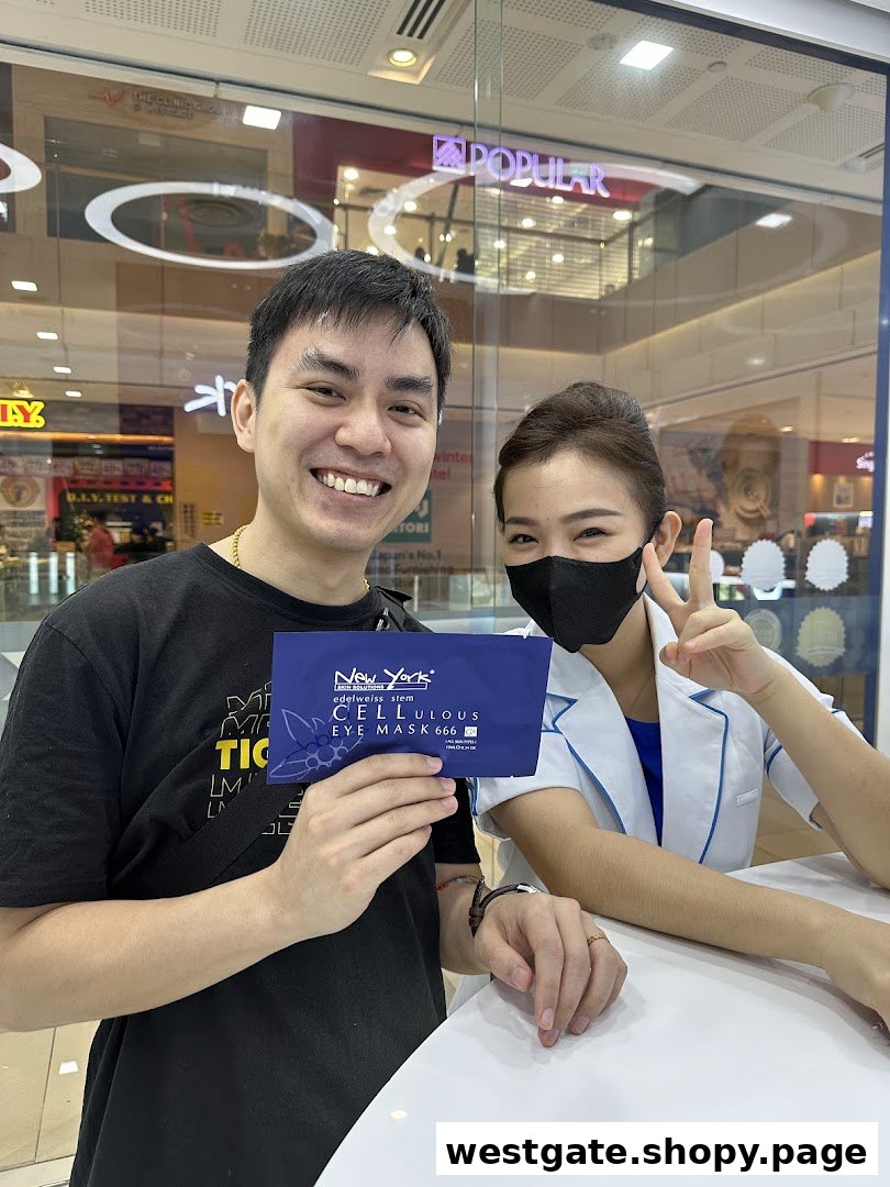 A man holds a New York Skin Solutions eye mask with a smiling staff member in a mall setting.