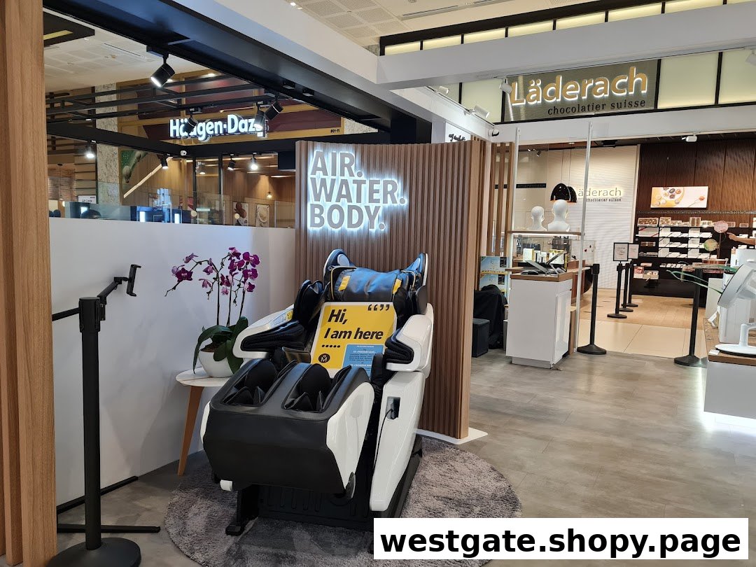 A modern massage chair display with a 'AIR. WATER. BODY.' sign, set within a shopping mall environment.