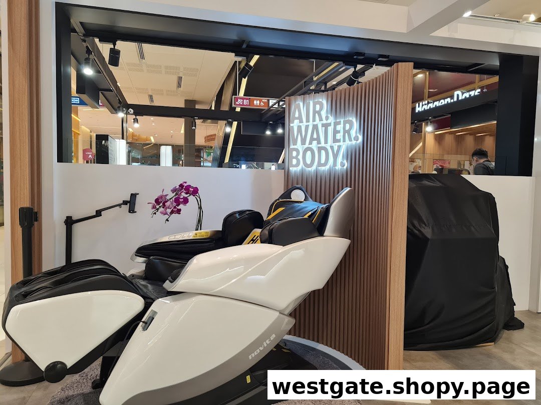 A display of modern massage chairs and wellness products inside Novita, featuring an 'AIR. WATER. BODY!' sign.