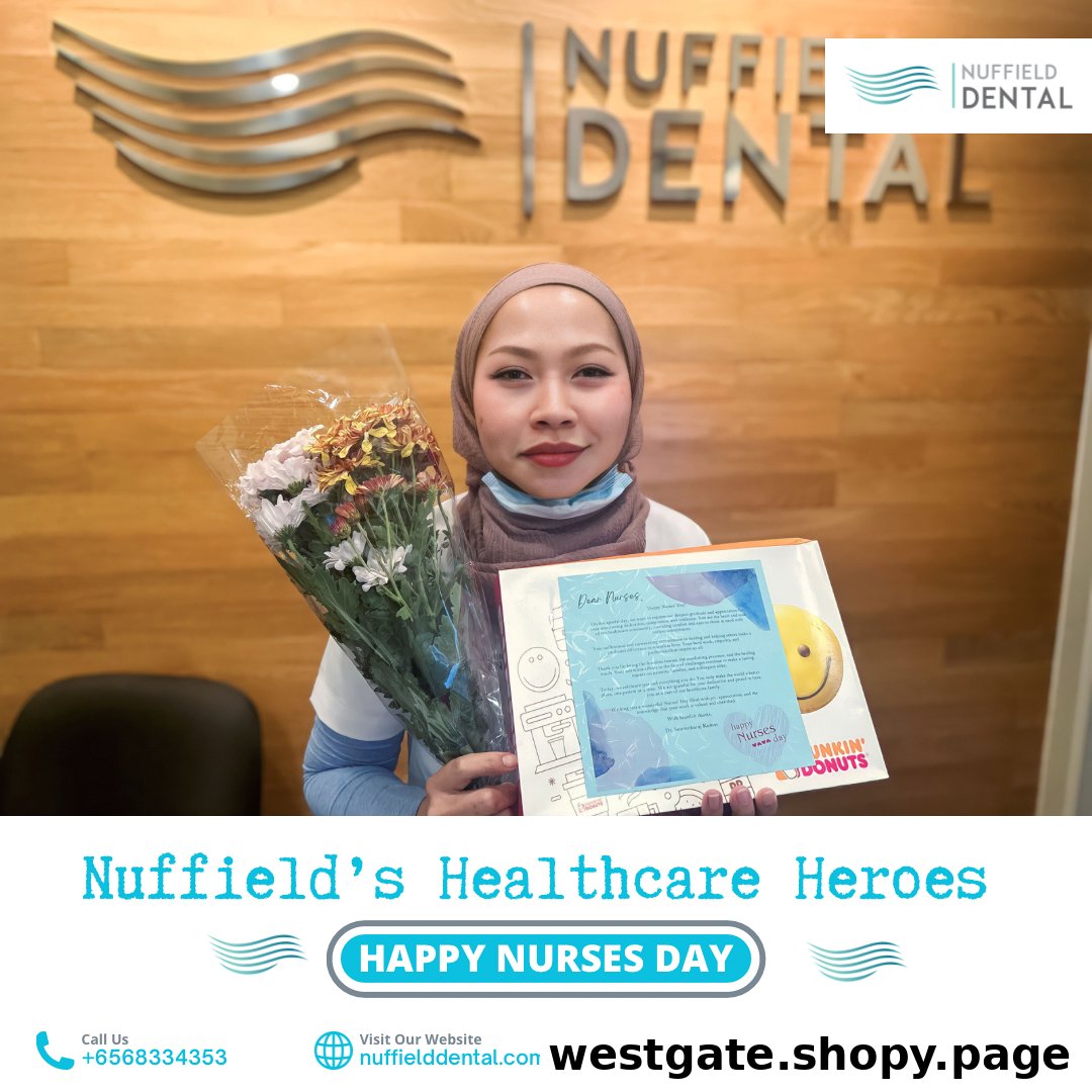 A Nuffield Dental staff member holds flowers and a gift, celebrating Nurses Day.