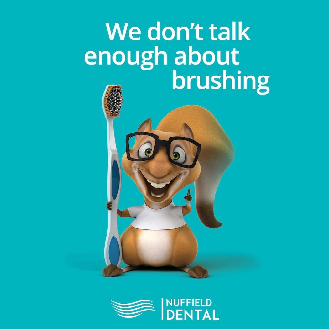 A cartoon squirrel with glasses holds a toothbrush on a teal background, promoting dental care.