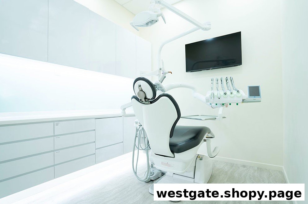 A modern, clean dental treatment room with a patient chair, overhead light, and dental tools.