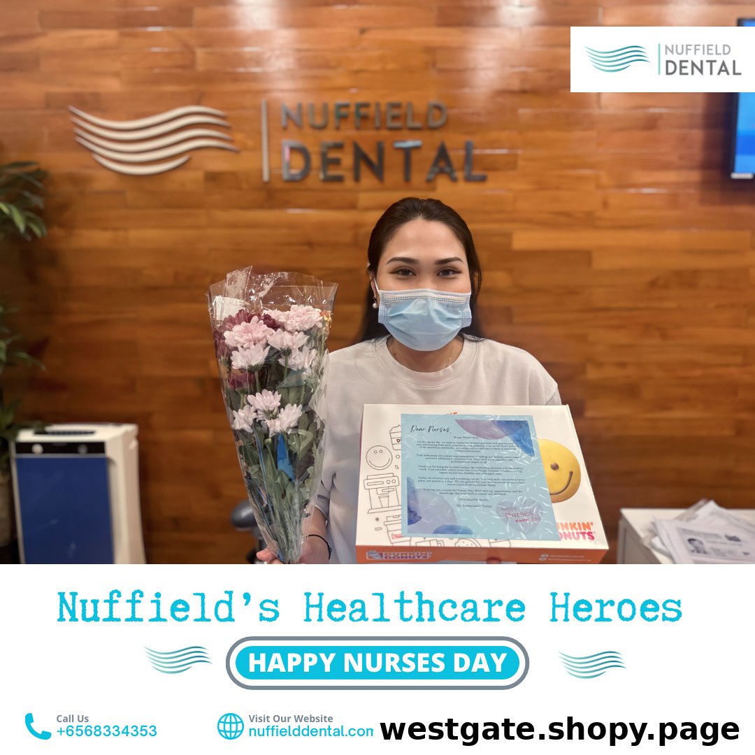 A Nuffield Dental staff member celebrates Nurses Day with flowers and a gift.