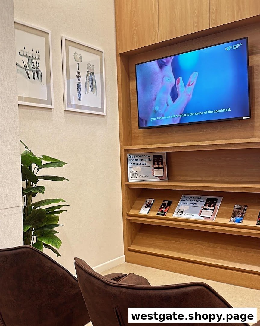 A modern and comfortable waiting area at Nuffield Dental with a TV and informational displays.