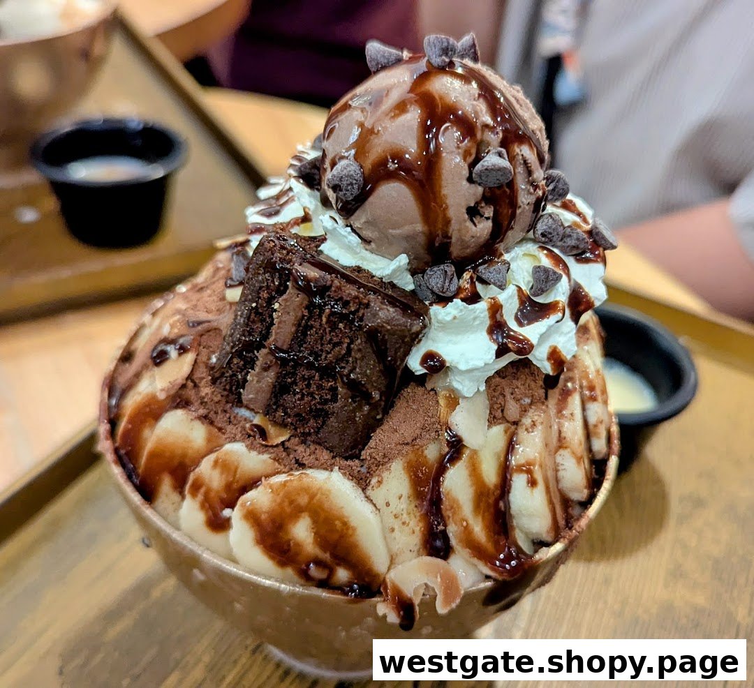 A decadent chocolate bingsu dessert topped with ice cream, whipped cream, brownie, and banana slices.