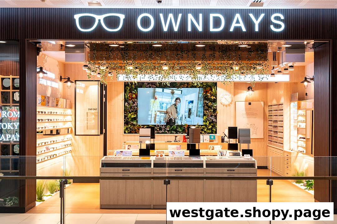 The bright, modern shopfront of OWNDAYS eyewear, featuring display cases, a large digital screen, and natural decor.