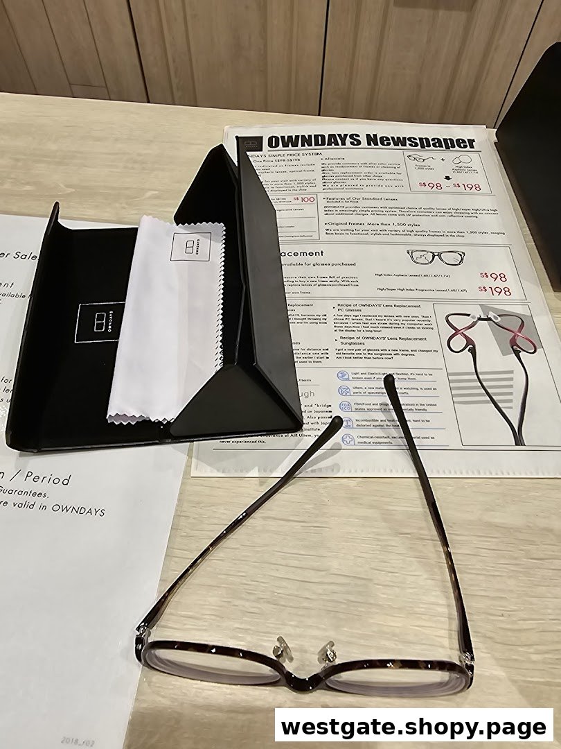A pair of glasses, case, and an OWNDAYS Newspaper detailing pricing and services.