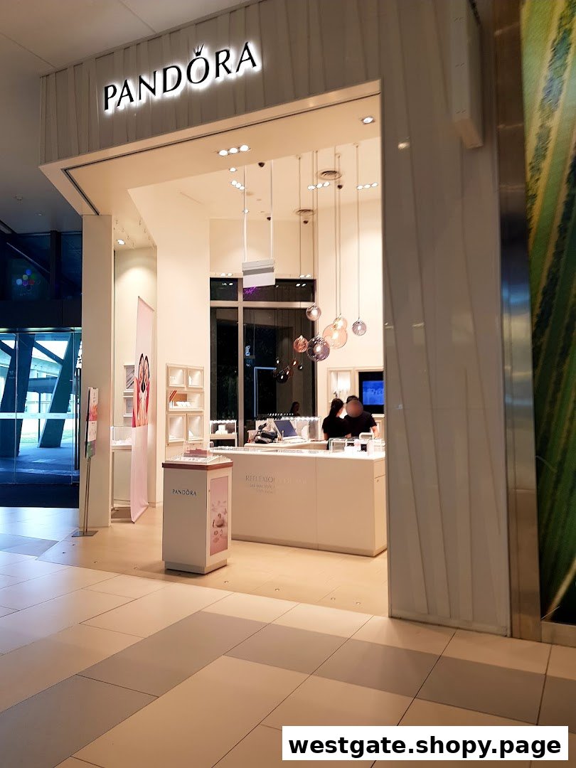 The brightly lit entrance of a Pandora jewelry store, showcasing its inviting interior.