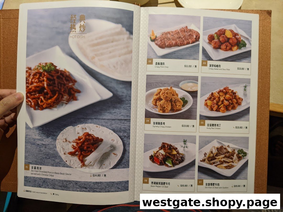 A vibrant menu page from Paradise Dynasty showcasing a variety of hot dishes with images and prices.