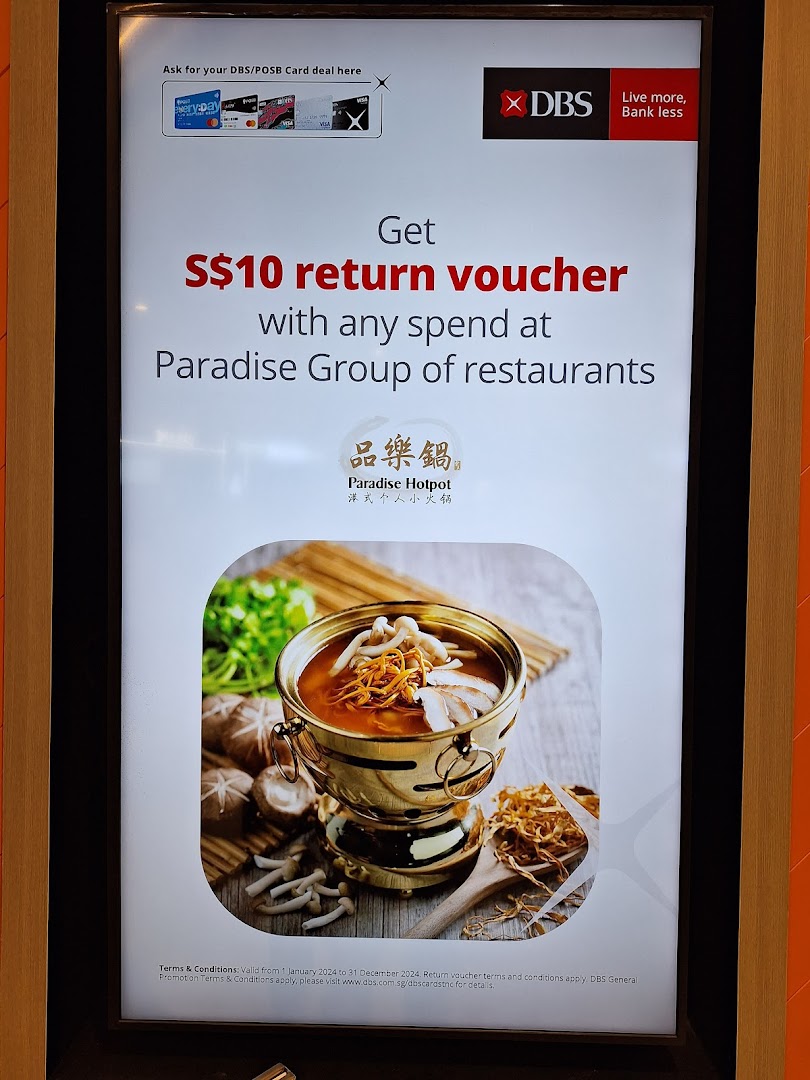 An advertisement for a DBS/POSB S$10 return voucher at Paradise Group restaurants.