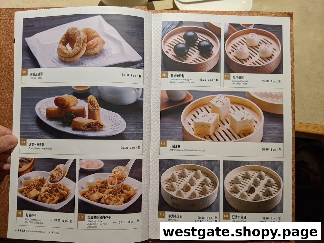 A close-up of a menu page from Paradise Dynasty, showcasing various dim sum and pastry dishes with prices.