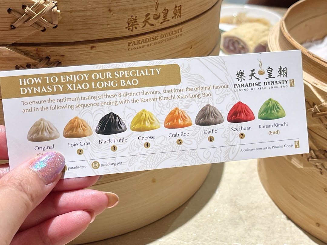 A card detailing 8 distinct flavors of Dynasty Xiao Long Bao with tasting instructions.