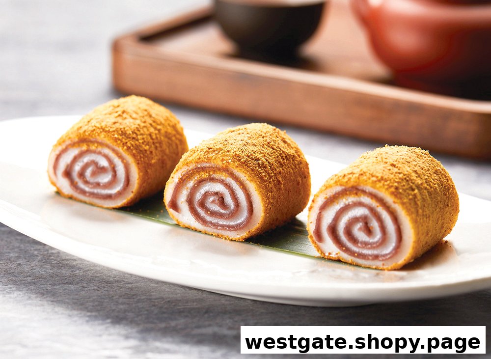 Three delicious red bean paste dessert rolls, dusted with powder, served on a white plate.