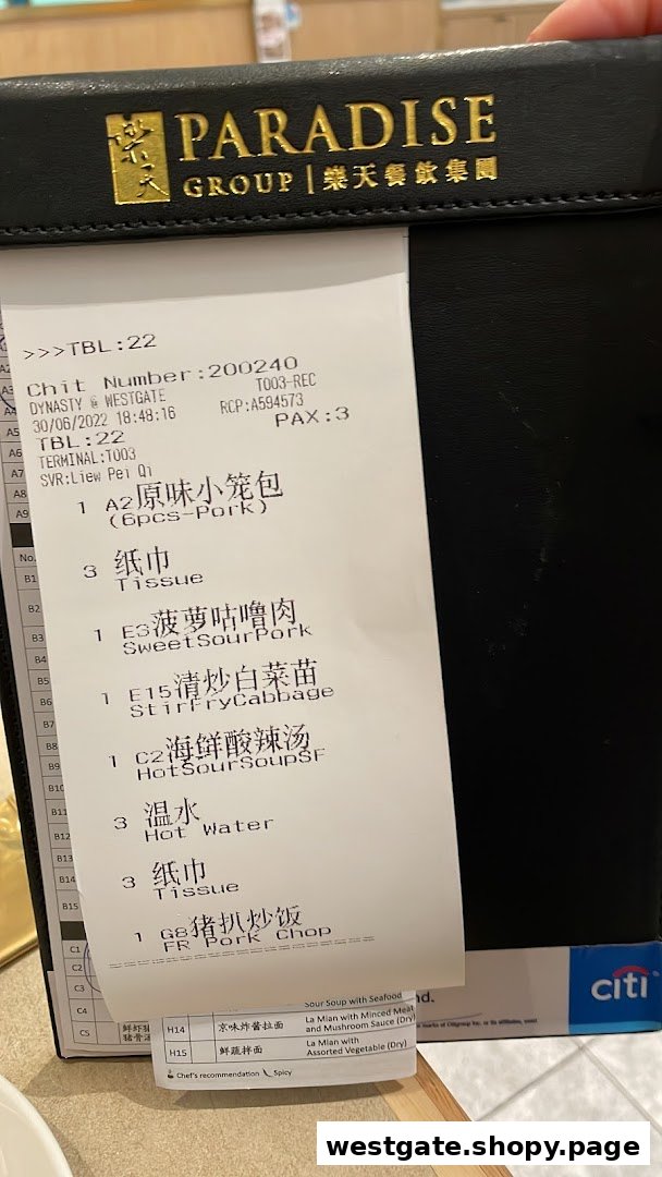 A close-up of an order slip from Paradise Dynasty at Westgate, listing various Chinese dishes.