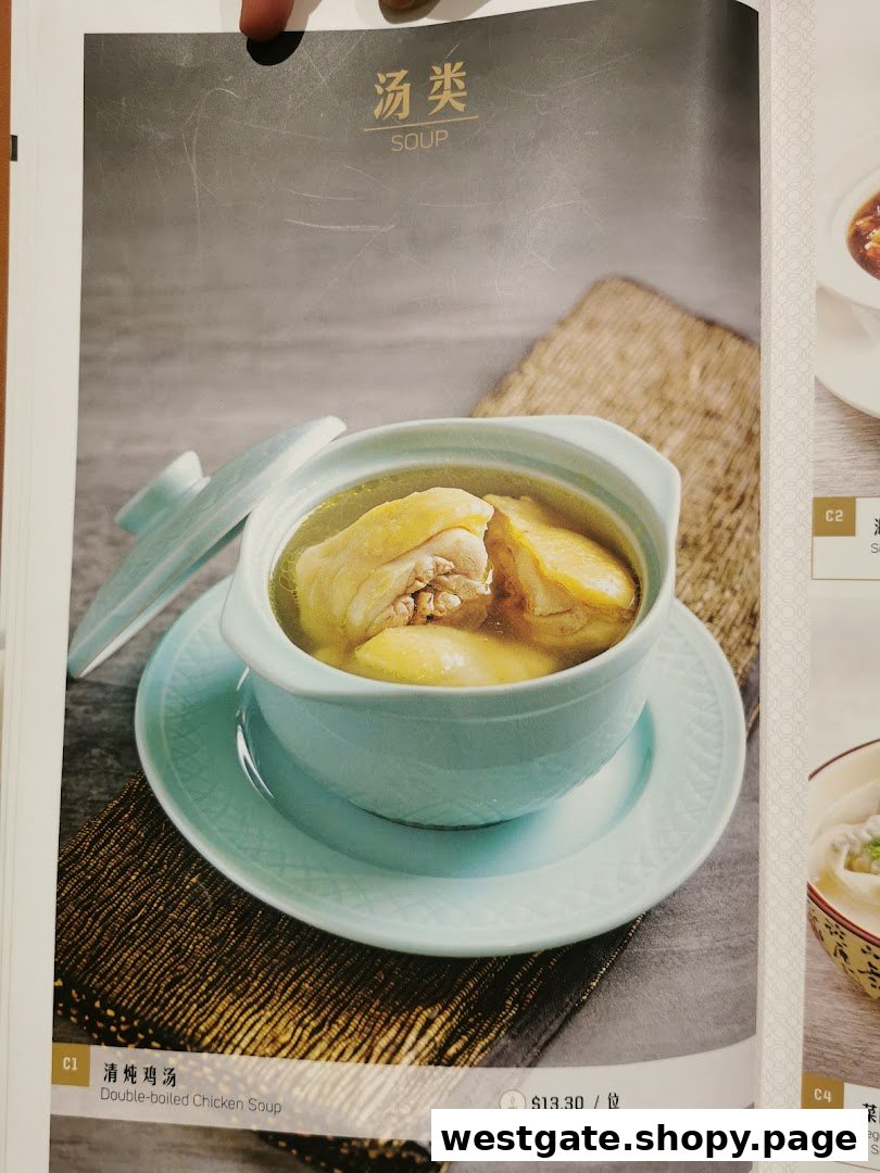 A menu page featuring a double-boiled chicken soup in a light blue ceramic pot.