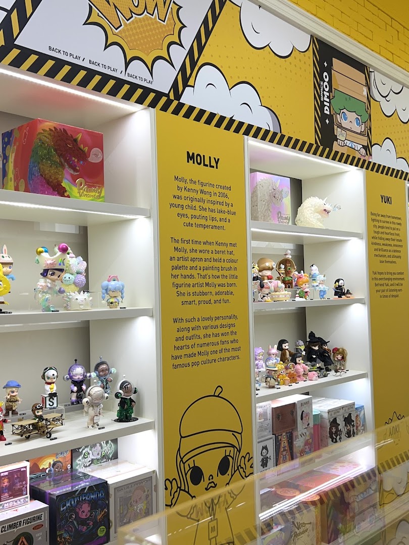 Interior view of POP MART Westgate, showcasing shelves filled with colorful, collectible art toys and character displays.