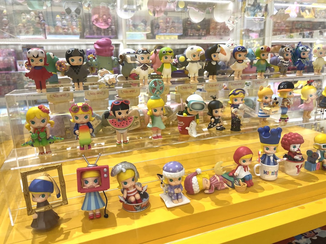 A vibrant display of diverse collectible figurines, showcasing various characters and themes within the POP MART store.