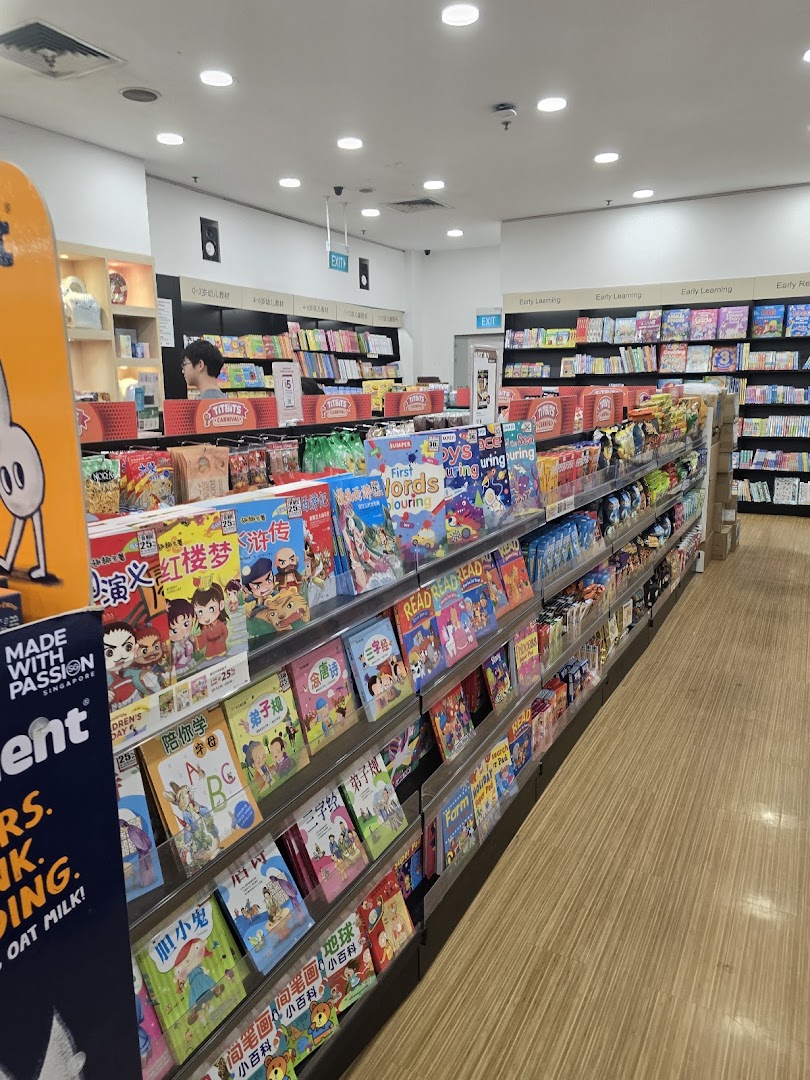 Interior view of POPULAR Bookstore, showcasing shelves filled with books, including children's and educational titles.