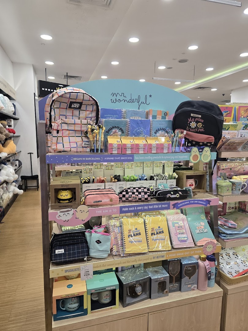 A vibrant display of 'Mr. Wonderful' brand stationery, bags, and gift items inside a bookstore.