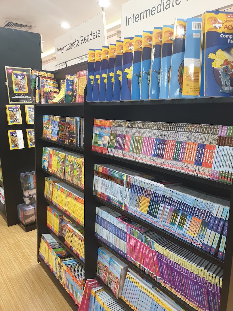 Shelves filled with diverse books, including sections for Intermediate Readers and Young Adult, at POPULAR Bookstore.