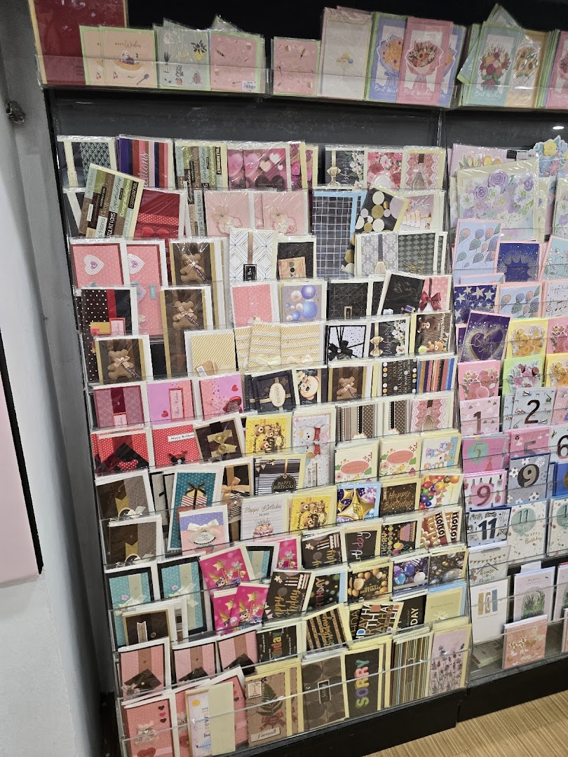 A vibrant display rack filled with a wide variety of greeting cards for all occasions.