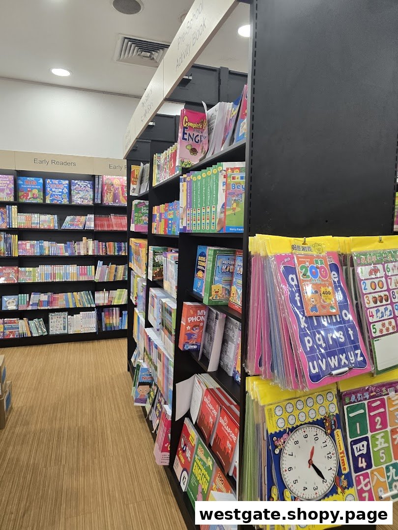 An aisle in POPULAR Bookstore featuring shelves of books, early readers, and educational activity materials.