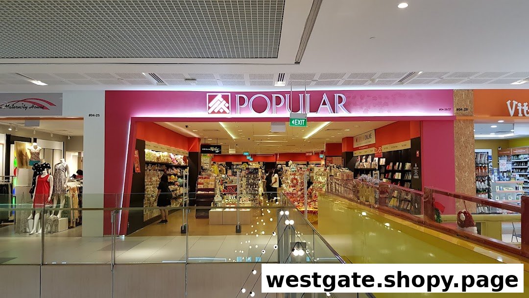 The brightly lit entrance of POPULAR Bookstore, showcasing its wide array of books and stationery.
