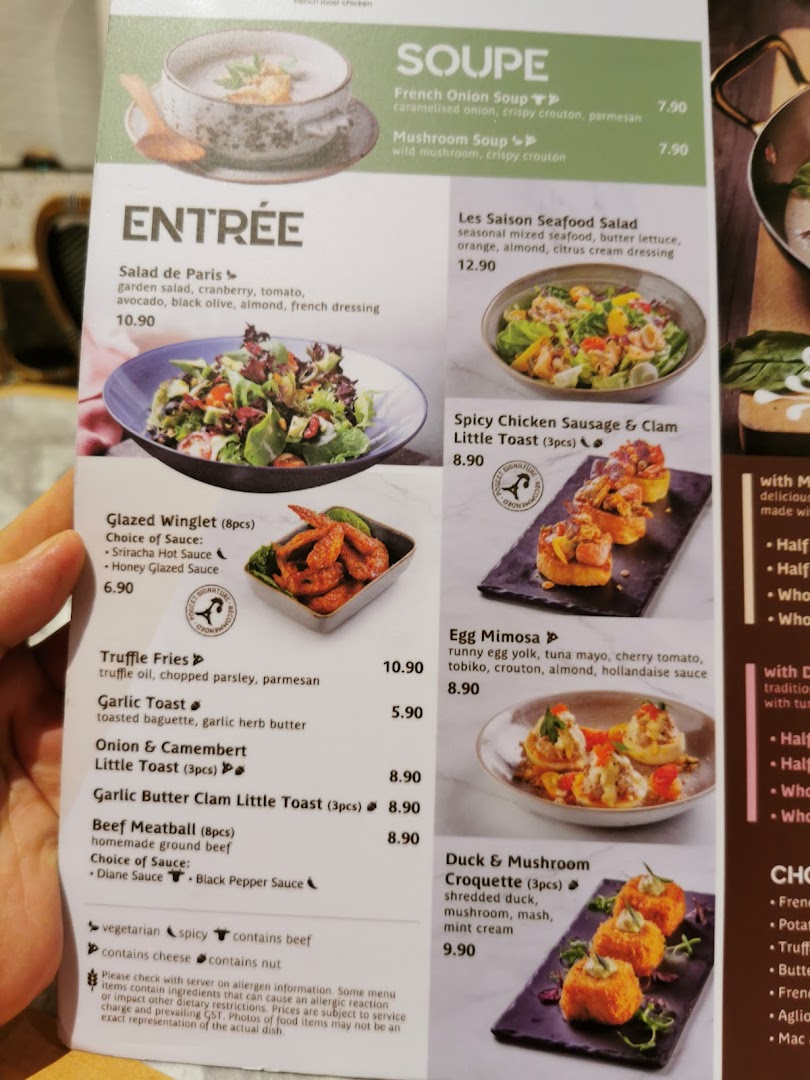 A detailed menu page from Poulet, showcasing a variety of soups and appetizers with descriptions and prices.