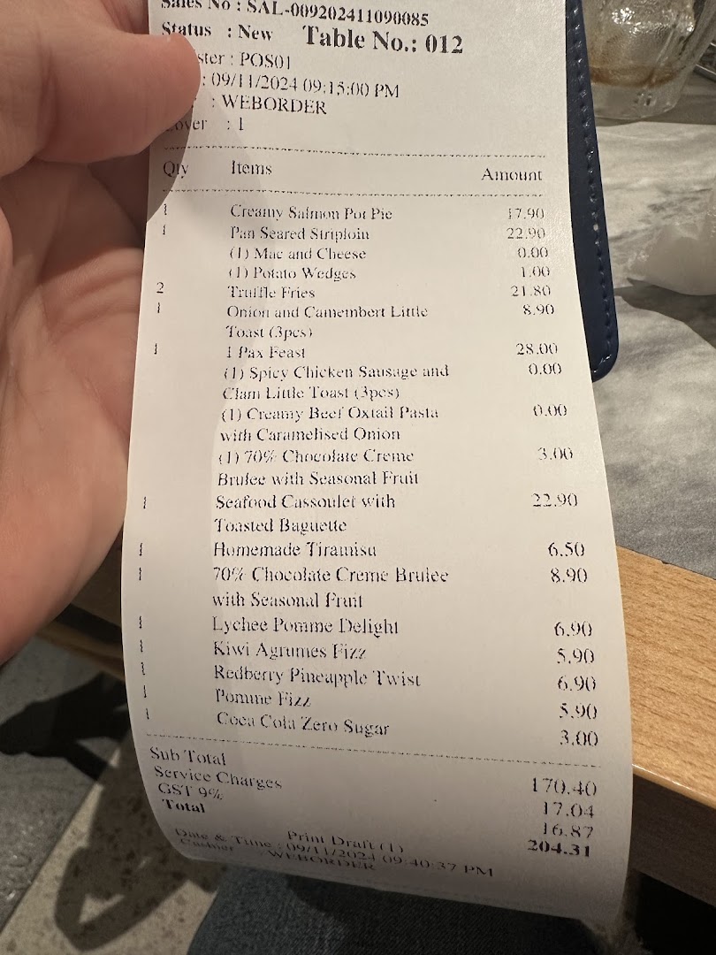 A detailed restaurant bill from Poulet - Westgate, showcasing various food and drink items with prices.