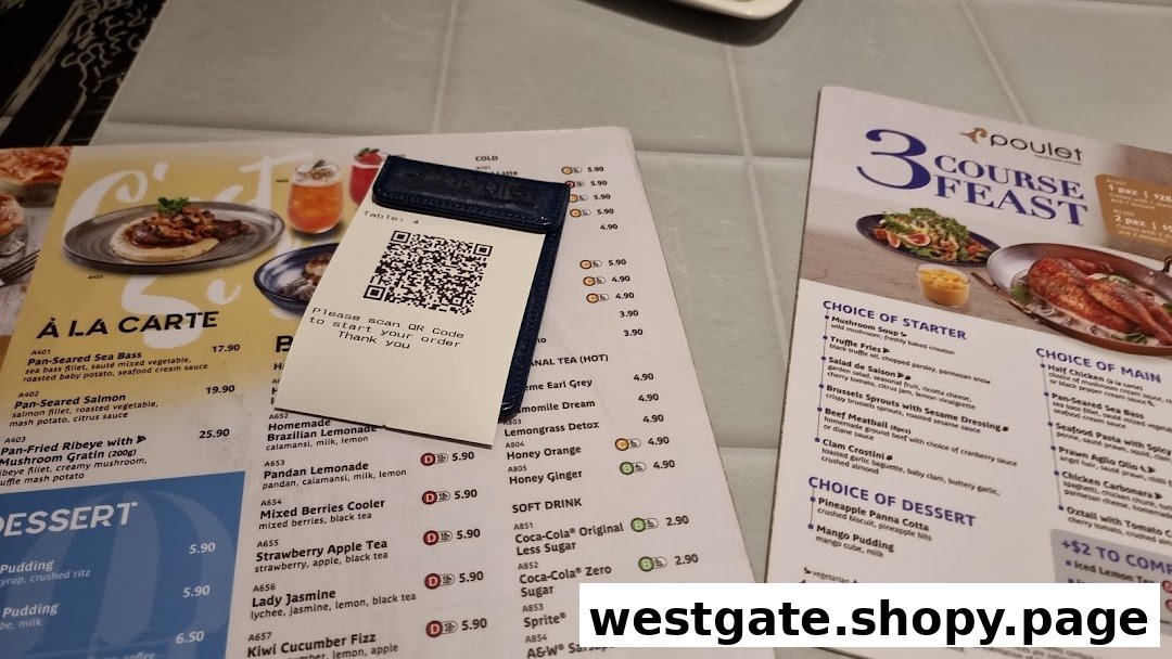 Close-up view of Poulet restaurant menus on a table, featuring a QR code for ordering.