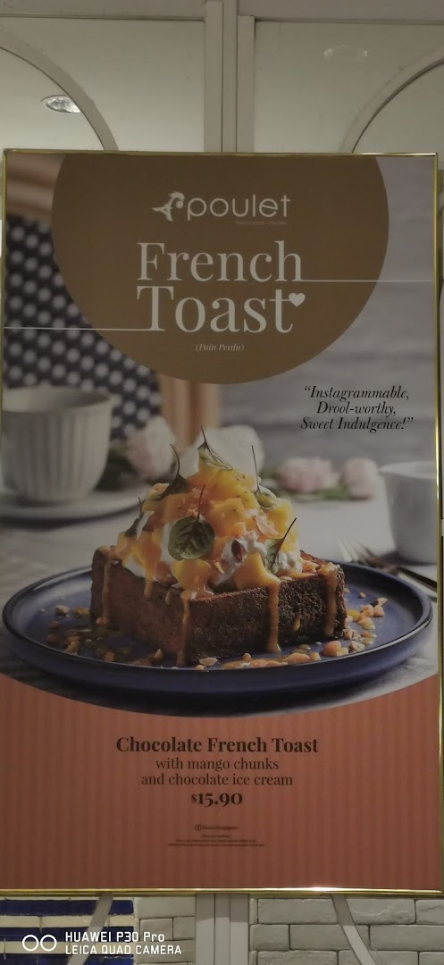 A promotional poster for Poulet's Chocolate French Toast with mango chunks and chocolate ice cream.