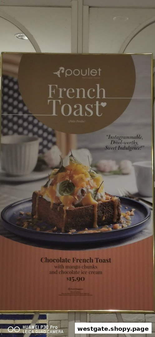A promotional poster for Poulet's Chocolate French Toast with mango chunks and chocolate ice cream.