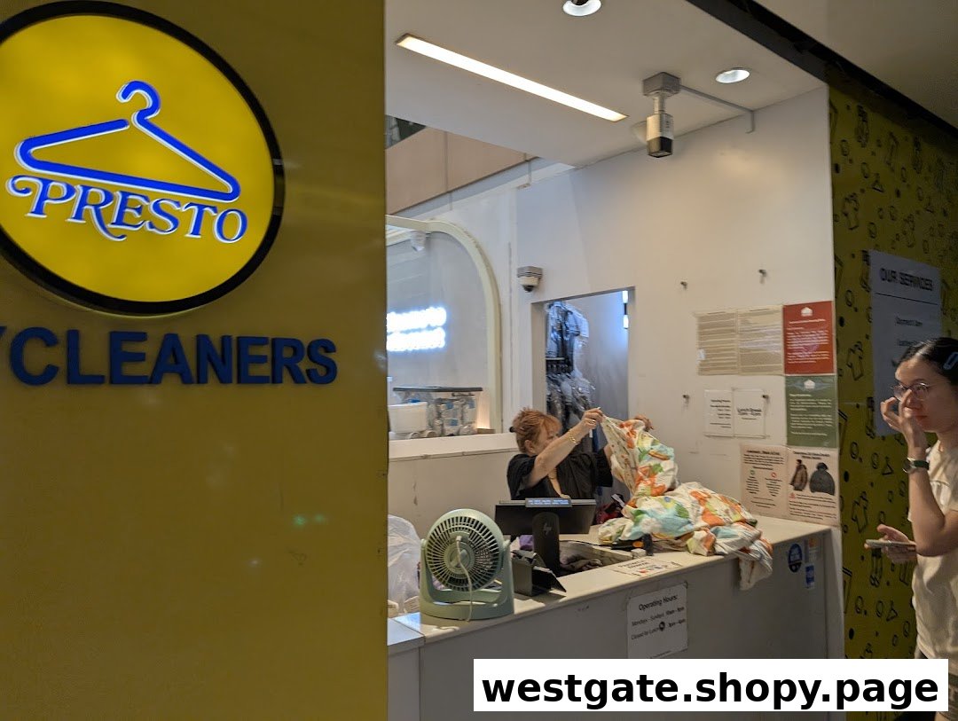 Presto Drycleaners' reception area with staff assisting a customer and the shop's prominent logo.