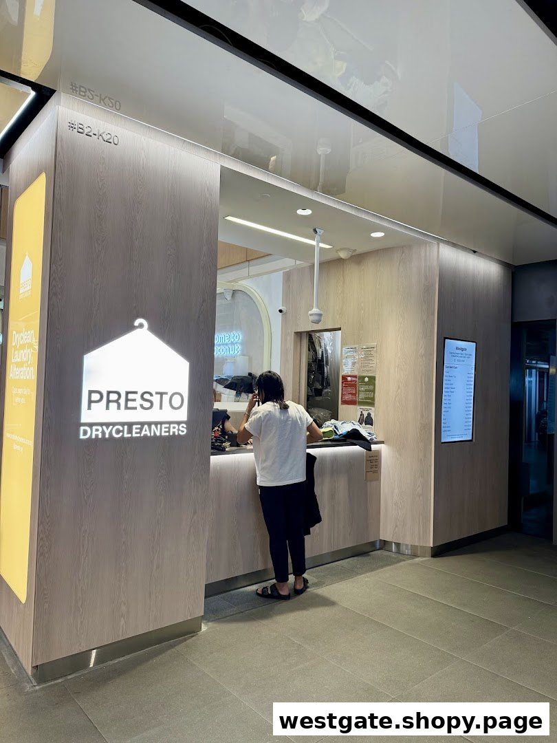 A customer at the counter of Presto Drycleaners, featuring the shop's logo and services.
