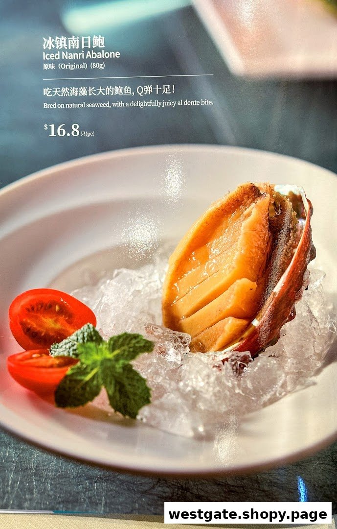 A close-up of Putien's Iced Nanri Abalone dish with its description and price on a menu.