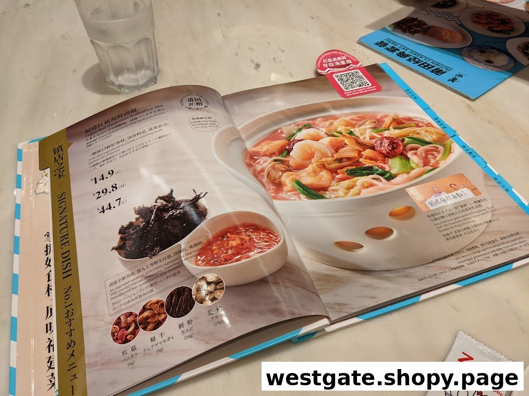 An open menu displaying PUTIEN's signature Fujian Red Mushroom Seafood Lor Mee with pricing.