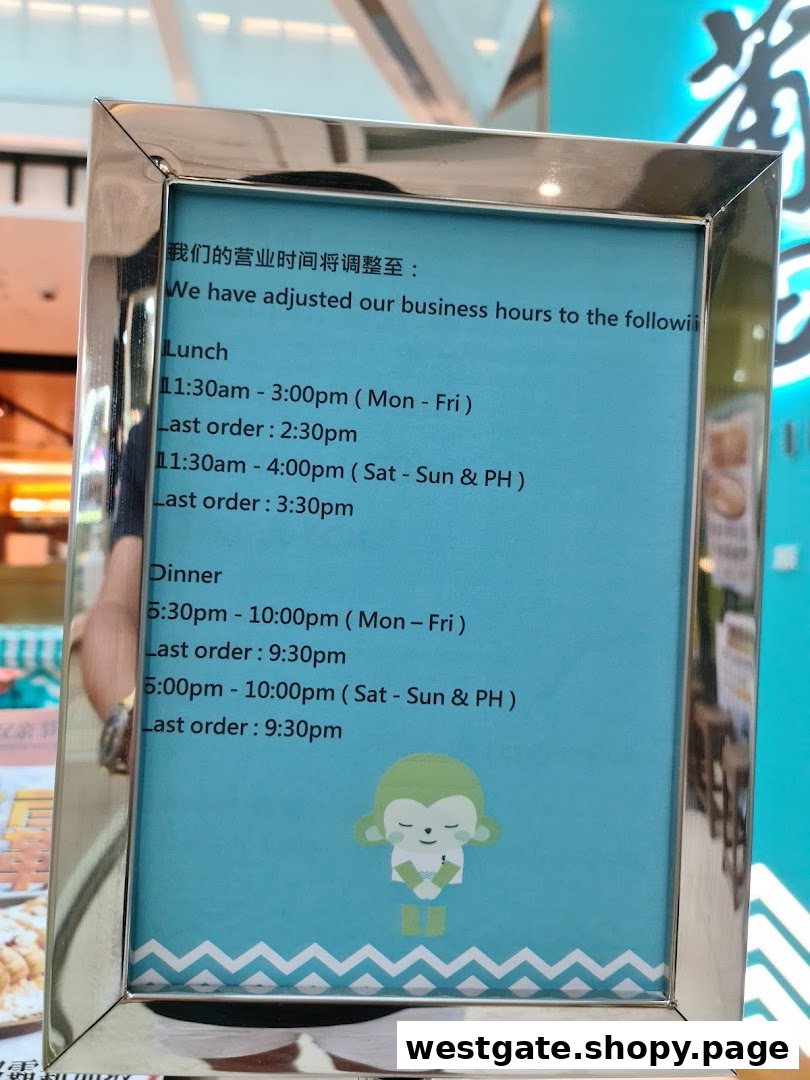 A sign displaying PUTIEN Westgate's adjusted lunch and dinner business hours and last order times.