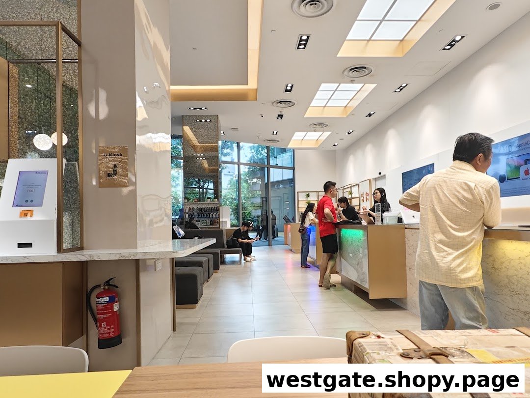 Interior view of QCD Technology, an Apple Authorised Service Provider, with customers at service counters.