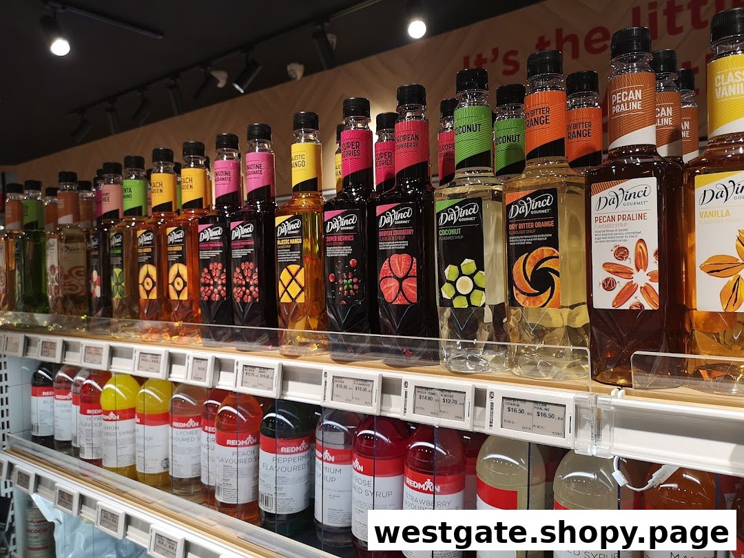 A vibrant display of DaVinci Gourmet and RedMan flavored syrups on retail shelves.