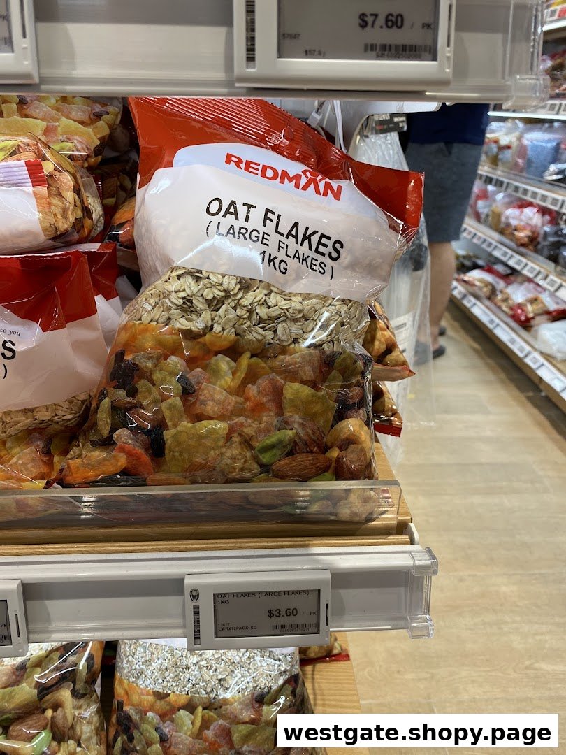 Bags of RedMan Oat Flakes and other dried goods on display in a retail store.